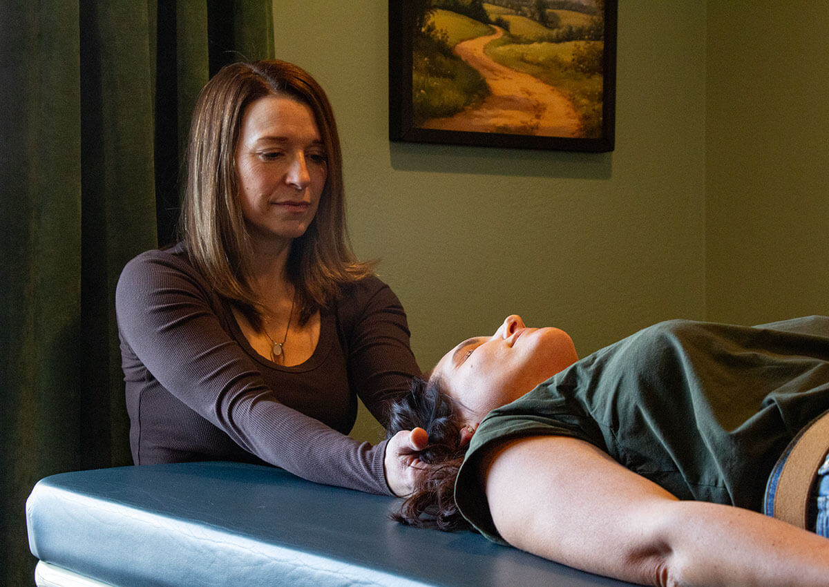 Chiropractor Dr. Shannon Petersen provides Cranial Sacral Therapy to a patient at Sherwood Chiropractic and Wellness WIsconsin